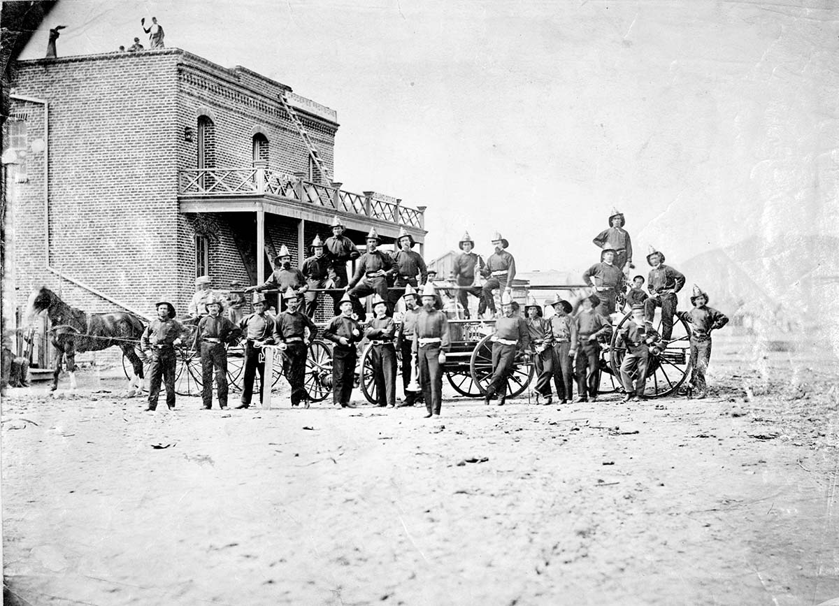 Carson City. Firemen's with fire engine, South Curry Street, 1868