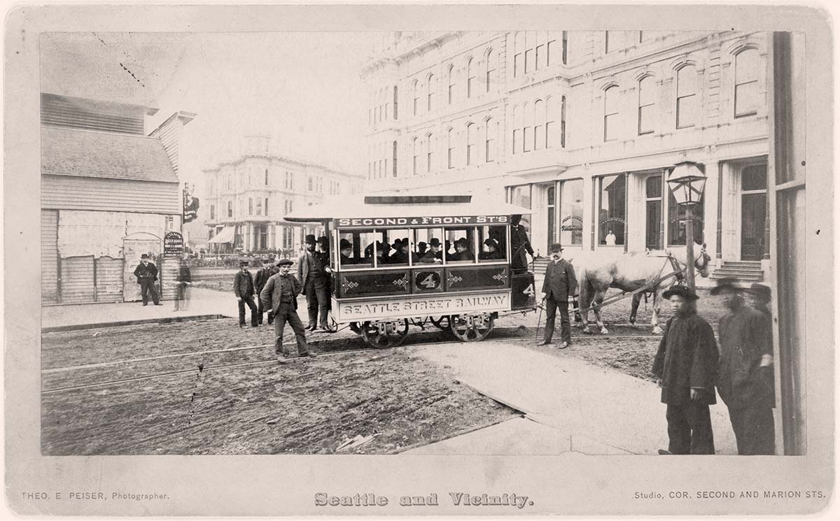 Seattle, Washington. First street car turning from Occidental Avenue to Yesler Way, 1884