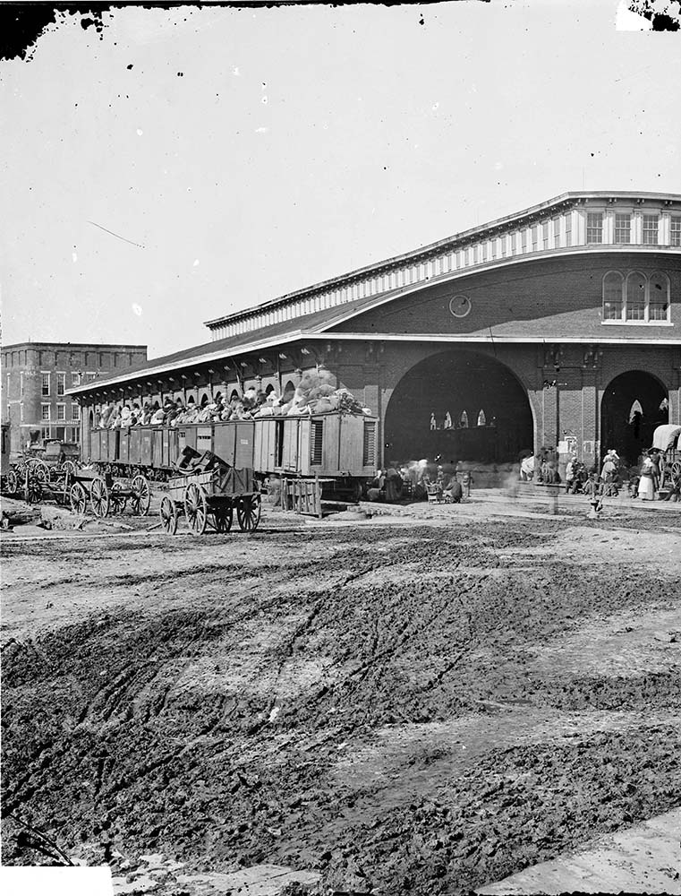 Atlanta, Georgia. Boxcars with refugees at railroad depot, 1864