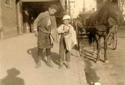 Dallas. Six-year old boy, Louis Shuman, and his 11 year old brother, newsboys, 1913