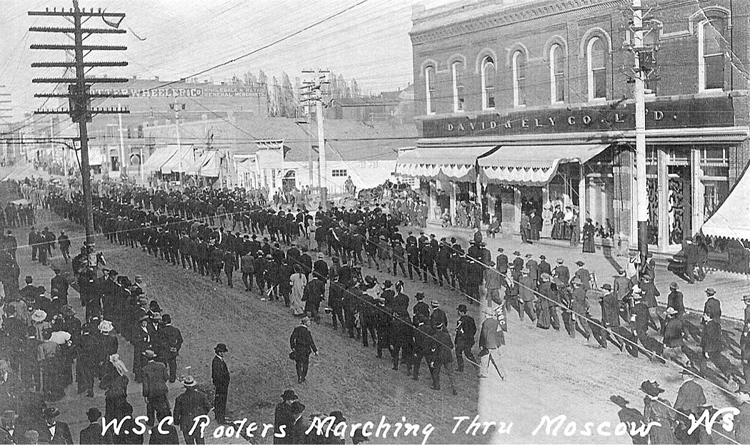 Moscow. Washington State College Rooters (Fans) marching down Main Street, 1900's