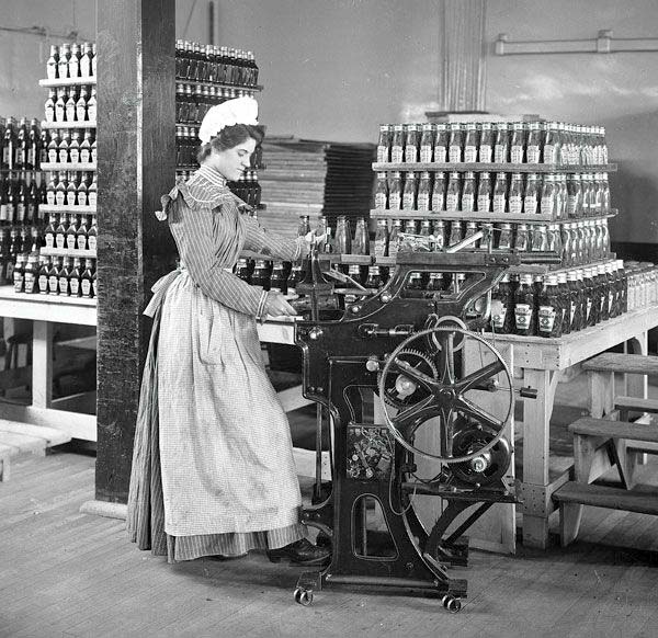 Pittsburgh. Female worker bottling ketchup at the original Heinz factory, 1897