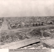 Sacramento. M Street and River in the distance from the new Capitol Building, 1866
