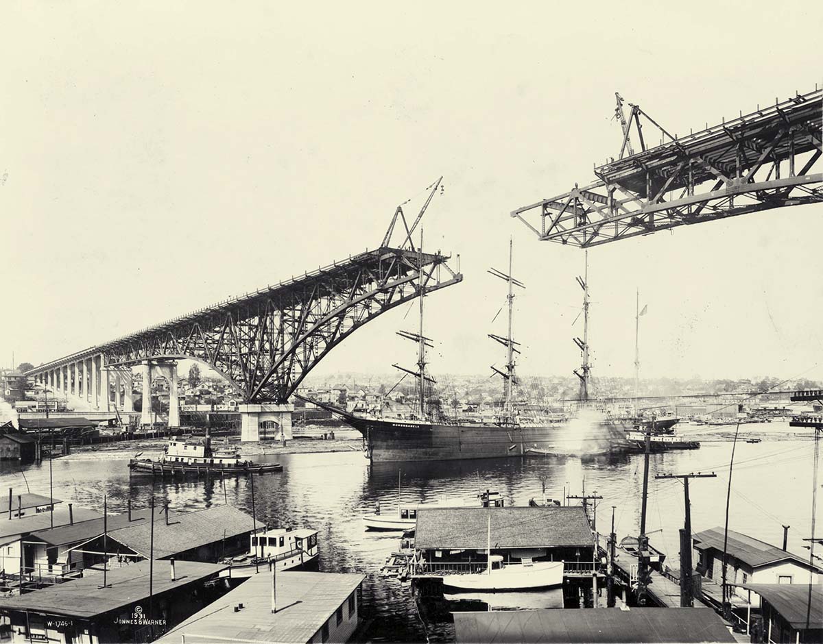 Seattle, Washington. A ship Monongahela, passing under Aurora Bridge, 1931